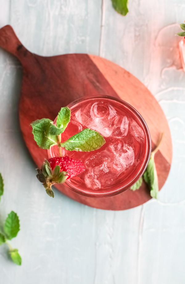 Strawberry Basil Gin Rickey in a glass with ice. 