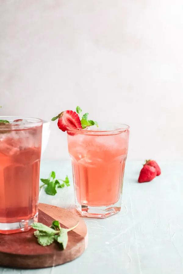 Strawberry Basil Gin Rickey served in 2 glasses. 