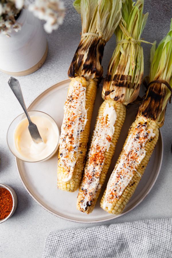 Grilled Mexican Corn on a plate. 