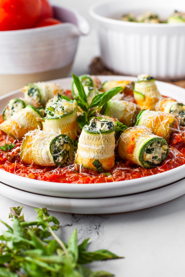 Zucchini Lasagna Rolls sprinkled with cheese. 