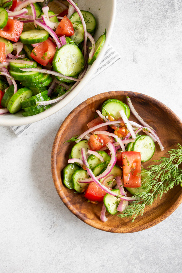 Cucumber Tomato Salad in a bowl and on a plate. 
