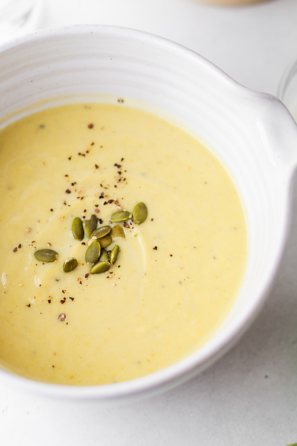 Instant Pot Zucchini Soup topped with pumpkin seeds. 