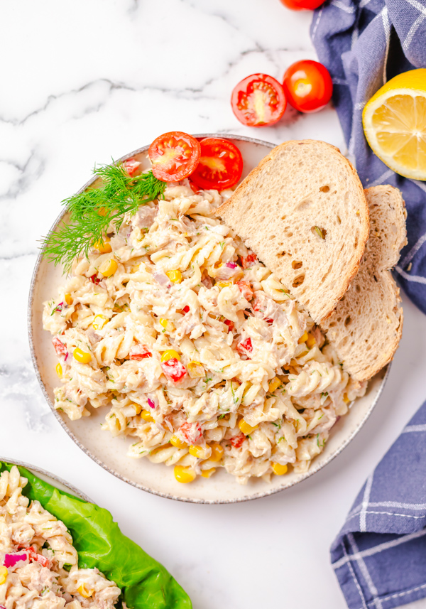 Tuna Pasta Salad on a plate with bread. 