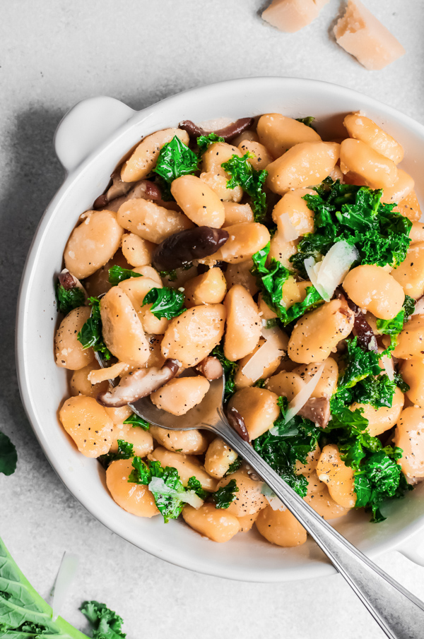 One Pot Mushroom Gnocchi in a bowl with a spoon. 