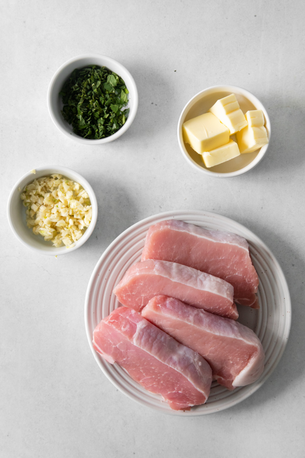 Raw ingredients to make pork chops in the air fryer. 