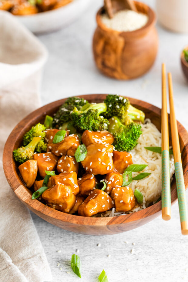 Instant Pot Teriyaki Chicken in a bowl with chopsticks. 