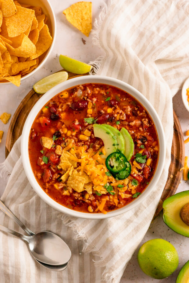 Slow Cooker Taco Soup in a bowl topped with cheese. 