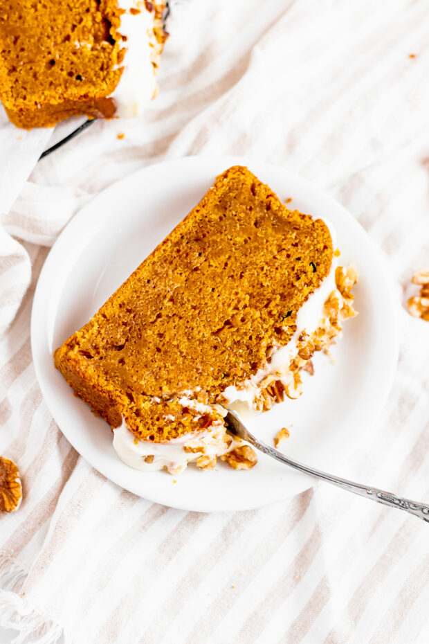 The Best Pumpkin Bread sliced on a plate. 