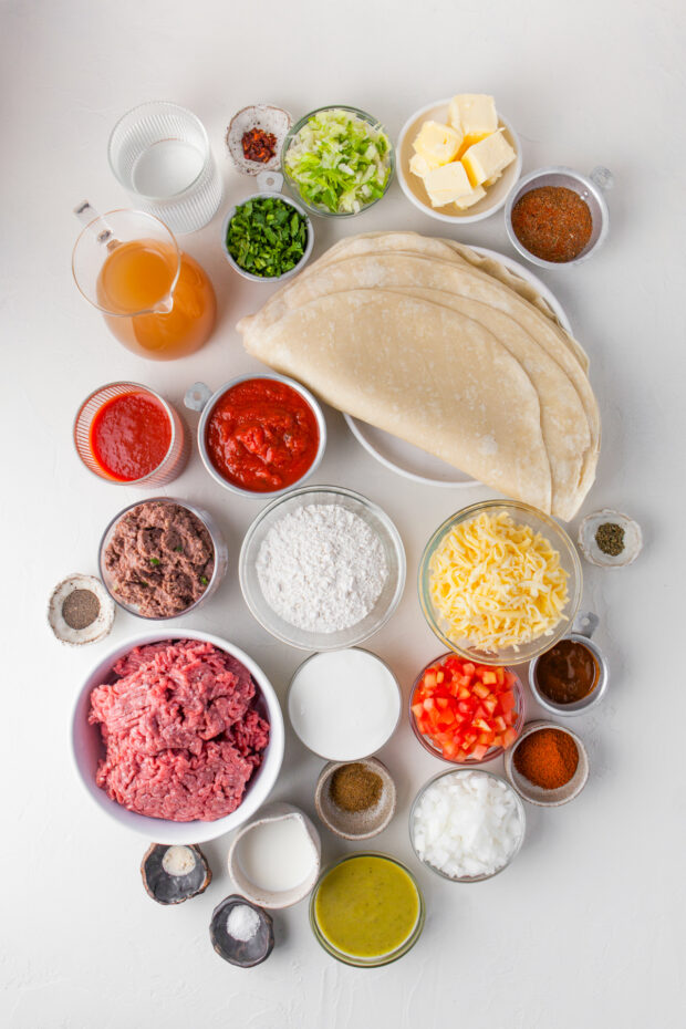 Ingredients to make Smothered Burritos on a table. 