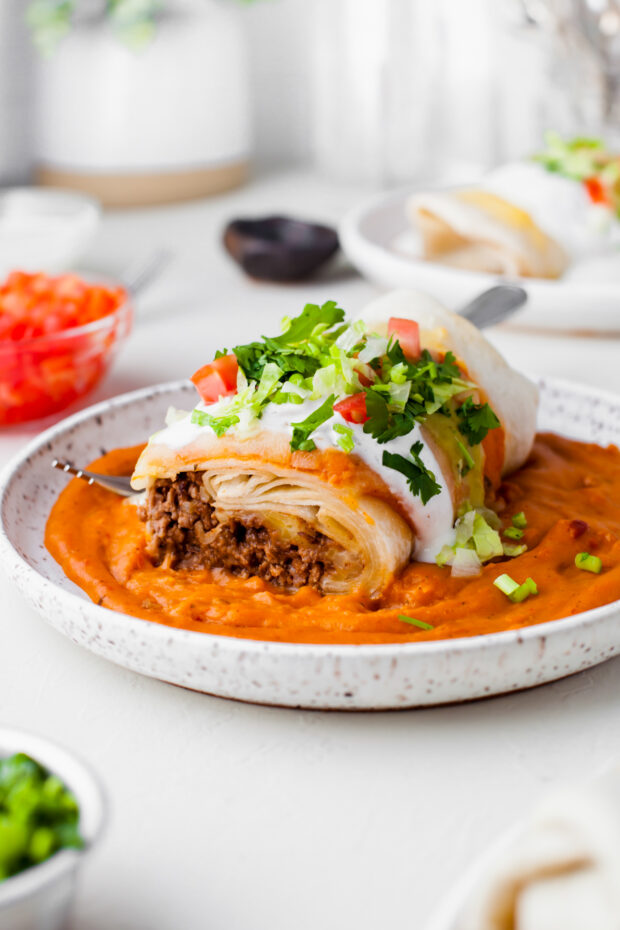 Smothered Burrito cut in half to show beef filling. 