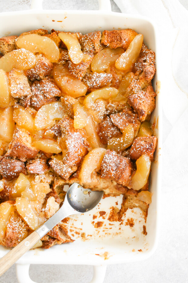 Apple Pie Baked French Toast in a white casserole dish. 