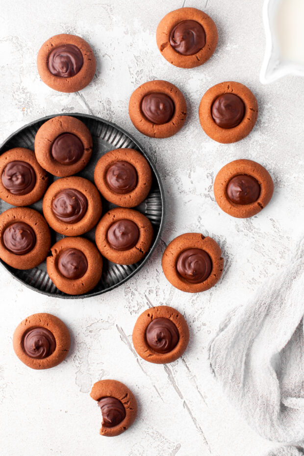 Double Chocolate Thumbprint Cookies on a plate sitting on a table. 