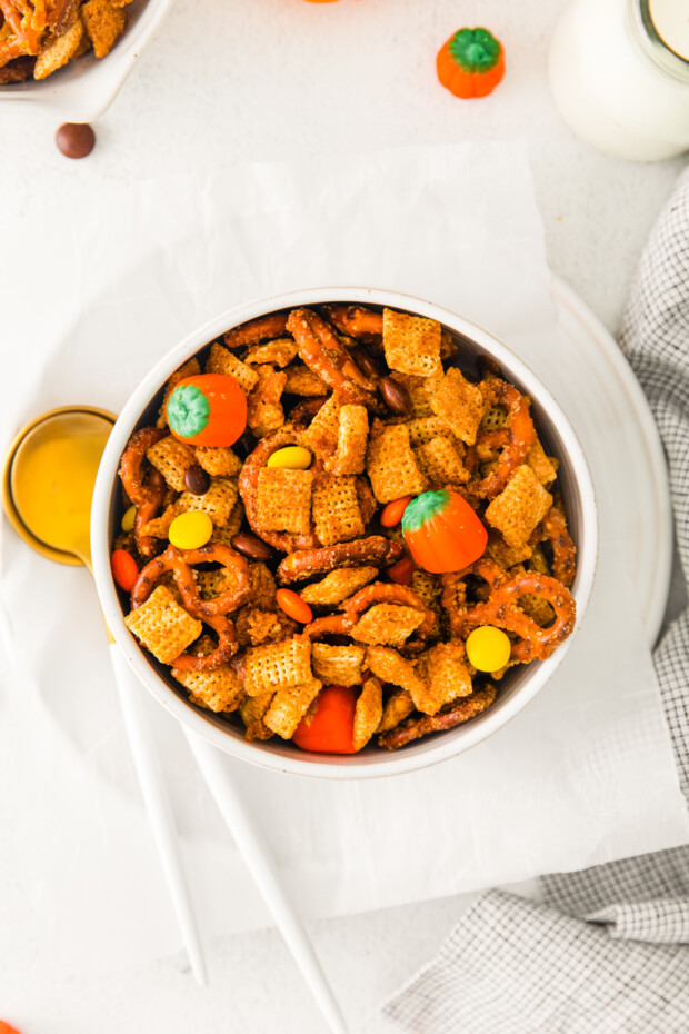 Harvest Chex Mix in a white bowl on a table. 