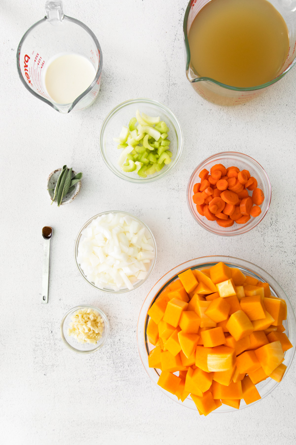 Ingredients to make Instant Pot Butternut Squash Soup on a table. 