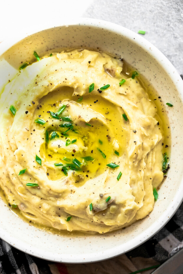 Instant Pot Mashed Potatoes with melted butter and herbs. 
