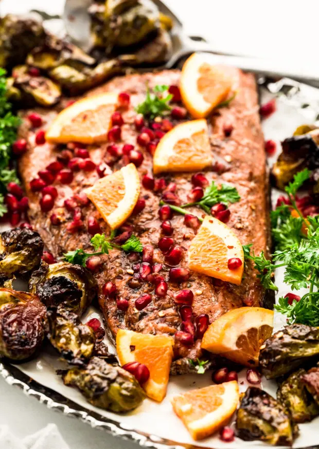 Marinated Sheet Pan Salmon topped with pomegranate seeds. 