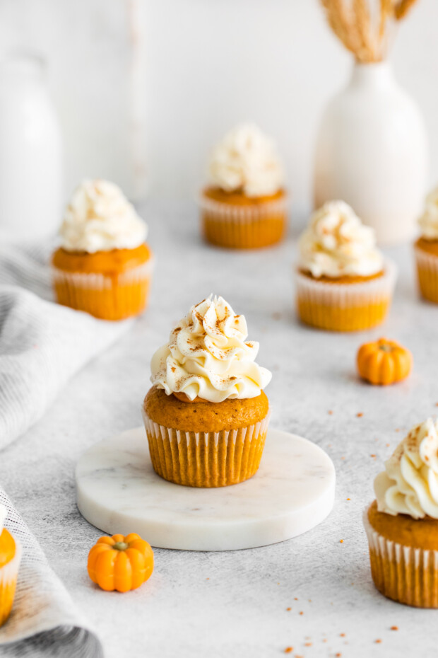 Pumpkin Pie Cupcakes on a white table.