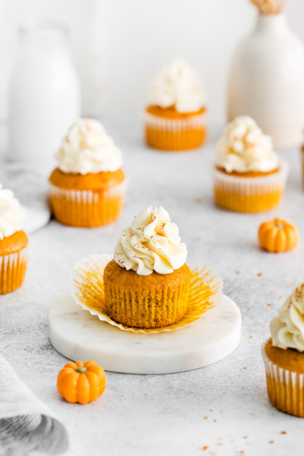 Pumpkin Pie Cupcakes topped with cream cheese frosting. 