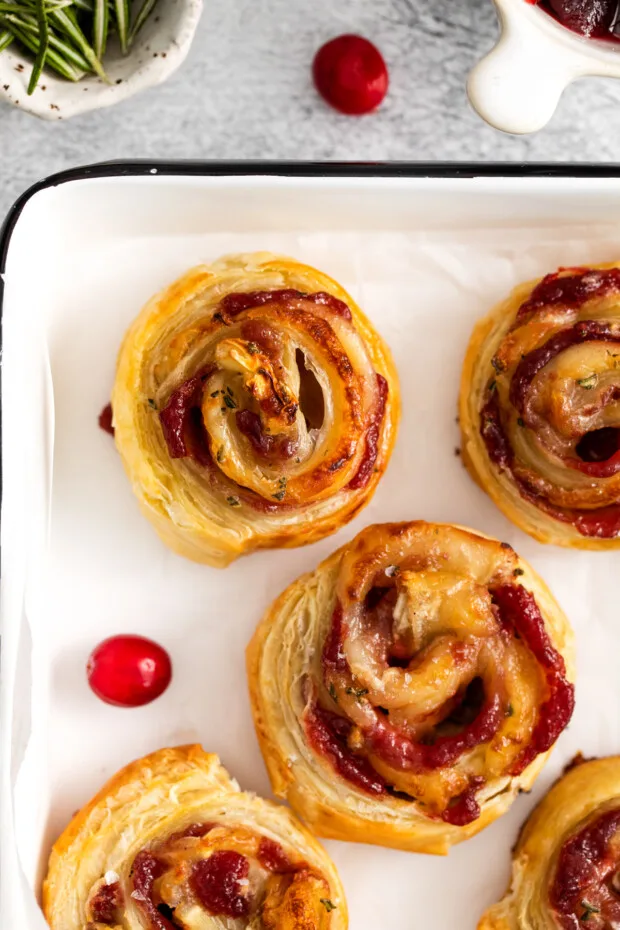 Cranberry Brie Pinwheels on a serving dish. 