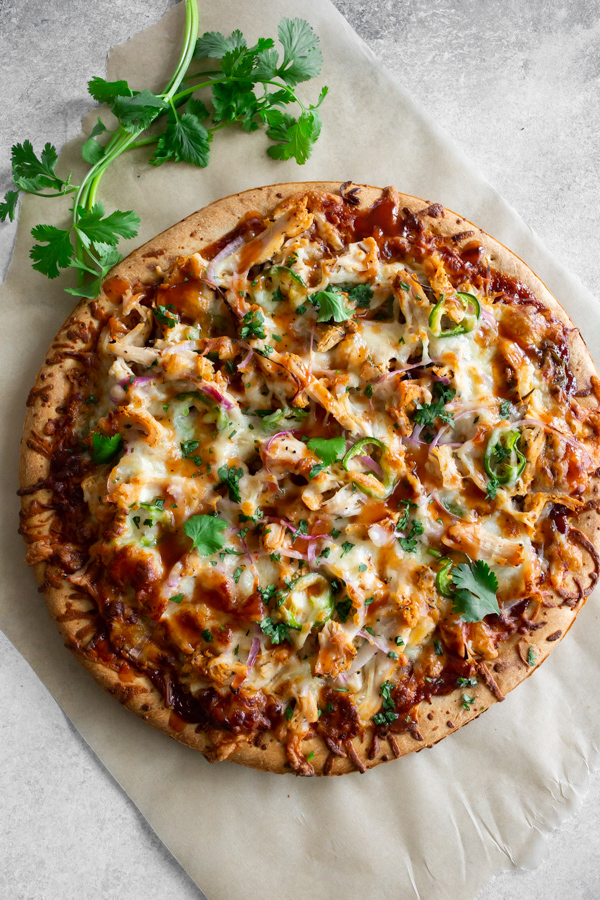 BBQ Chicken Pizza on a piece of parchment paper. 