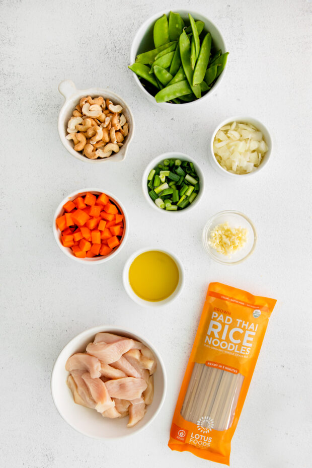 Ingredients to make Cashew Chicken Pad Thai on a table. 