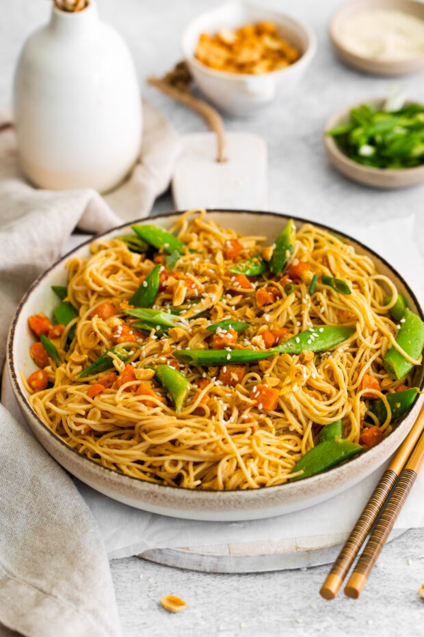 Spicy Peanut Noodles served with sesame seeds and chopped peanuts. 