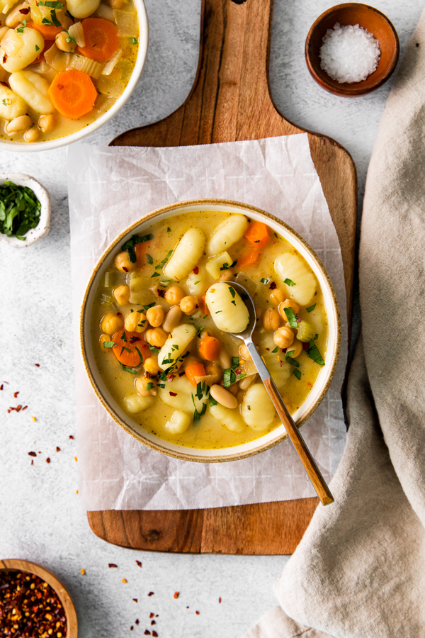 Vegetable Gnocchi Soup in a bowl with a spoon. 