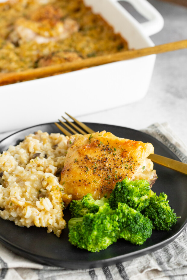 Easy Chicken and Rice Casserole served with broccoli. 