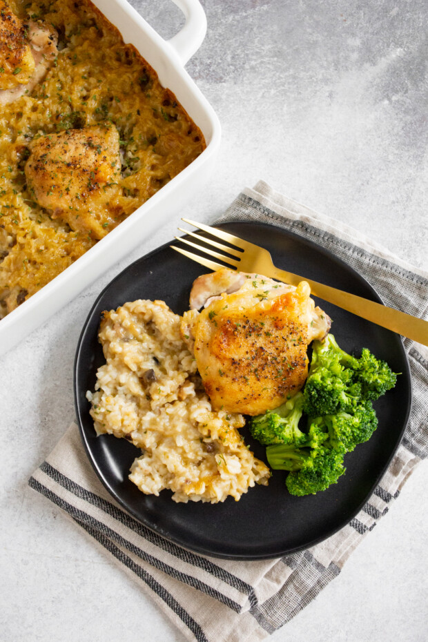 Easy Chicken and Rice Casserole served on a plate with broccoli. 