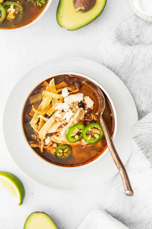 Instant Pot Chicken Tortilla Soup with a spoon in the bowl. 