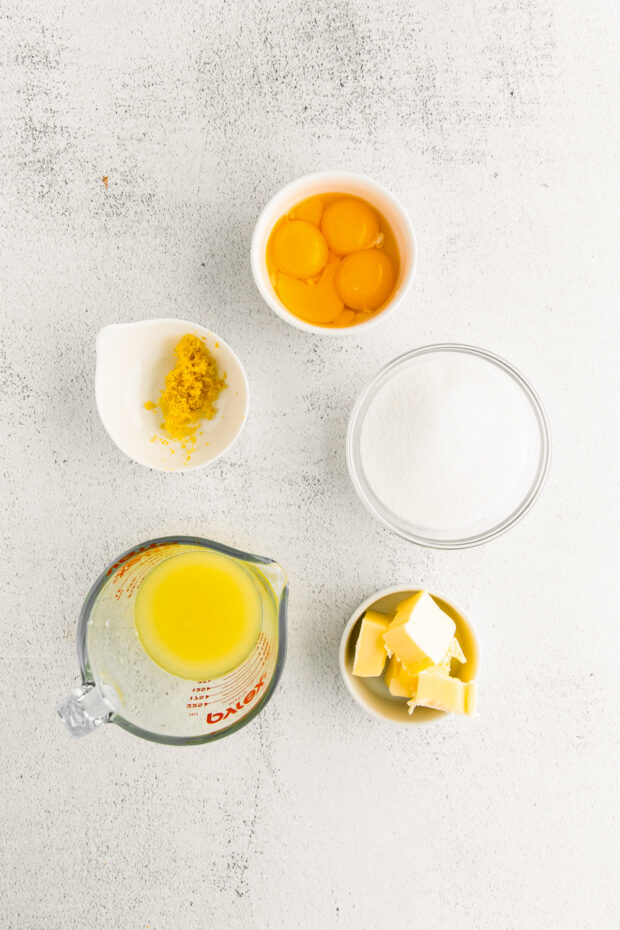 Ingredients for lemon curd on a table. 