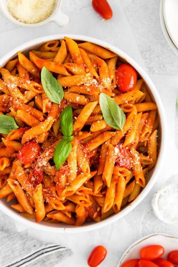 Penne Arrabbiata served with Parmesan cheese. 