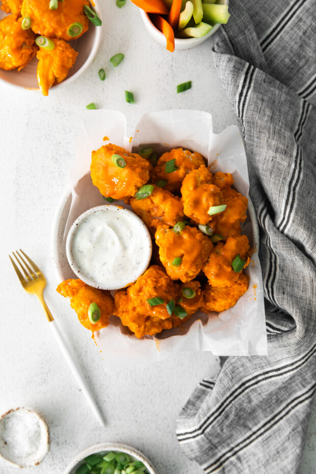 Air Fryer Buffalo Chicken Nuggets served with green onion. 