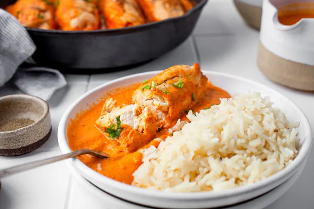 Creamy Chipotle Chicken on a plate with rice. 