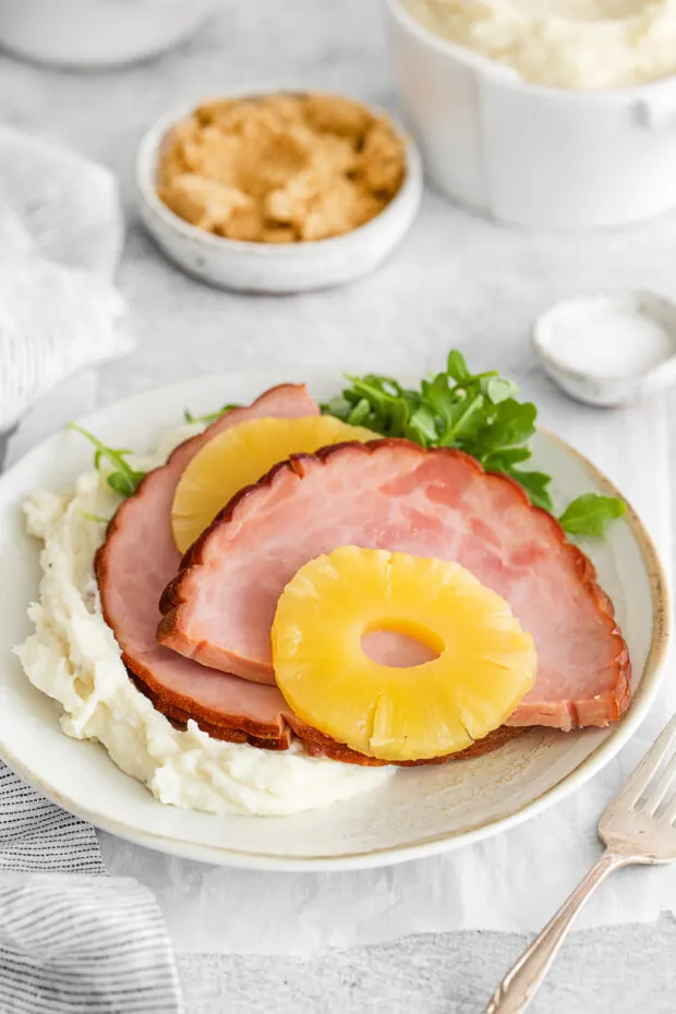 3-Ingredient Instant Pot Ham served with mashed potatoes. 
