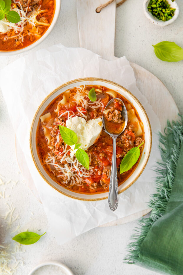 Instant Pot Lasagna Soup in a bowl with a spoon. 