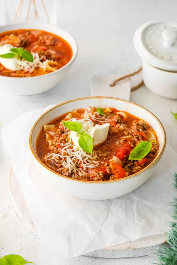 Instant Pot Lasagna Soup served with shredded cheese. 