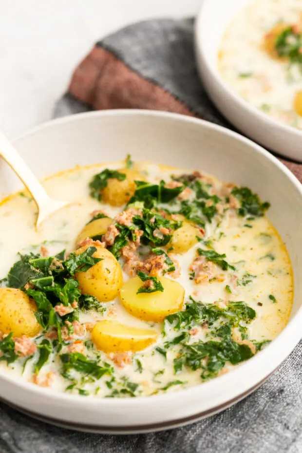 A bowl filled with Instant Pot Zuppa Toscana Soup. 