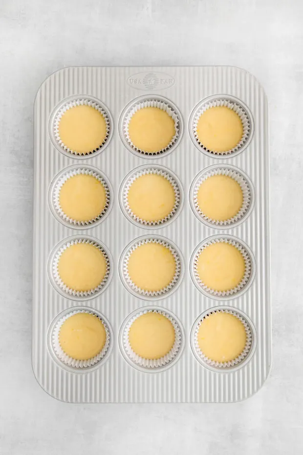Lemon cupcakes in a cupcake pan. 