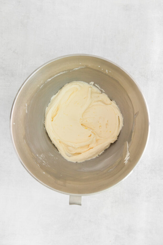 Lemon curd buttercream in a mixing bowl. 