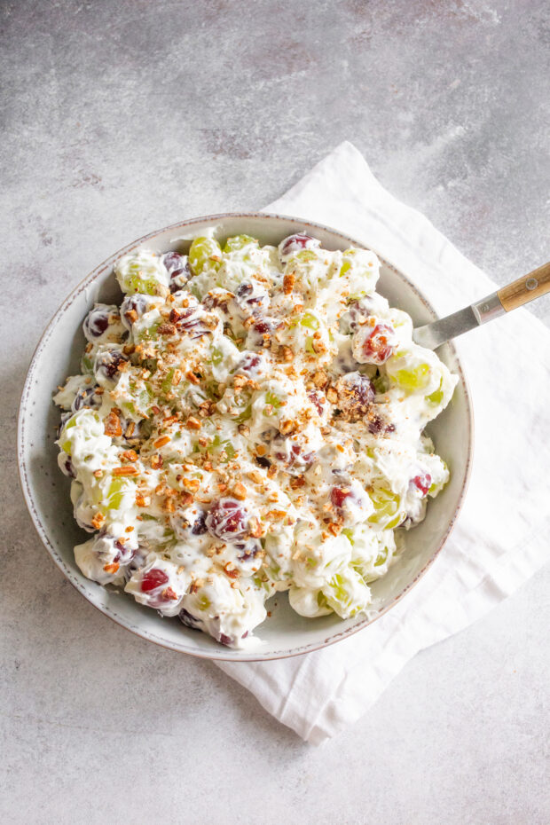 Sweet Grape Salad topped with chopped pecans. 