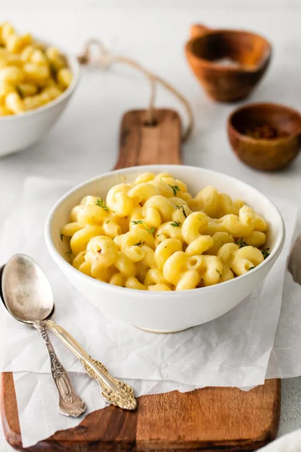 White Cheddar Mac and Cheese in a white bowl. 