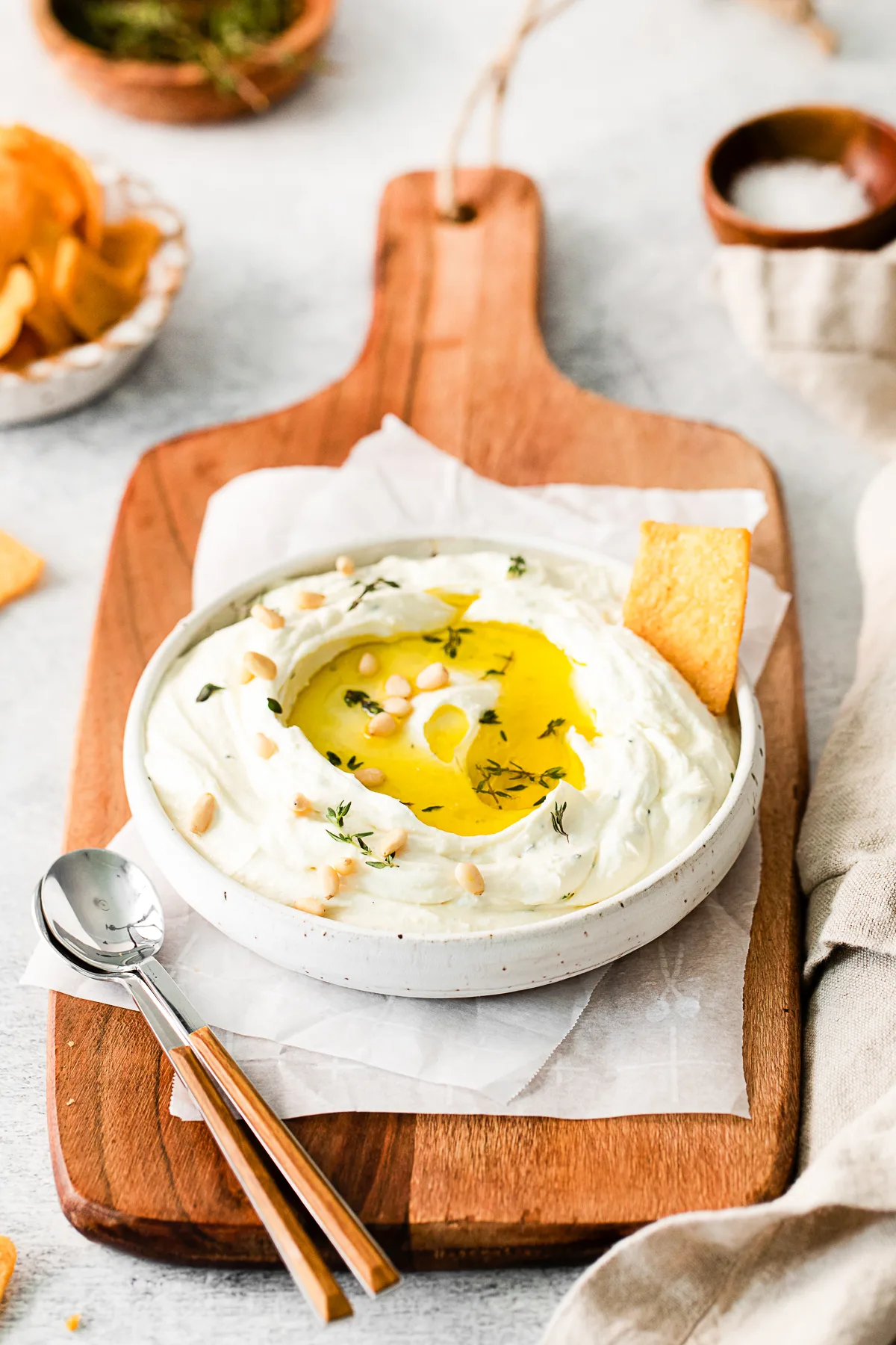 Roasted Garlic Whipped Feta in a bowl with olive oil. 