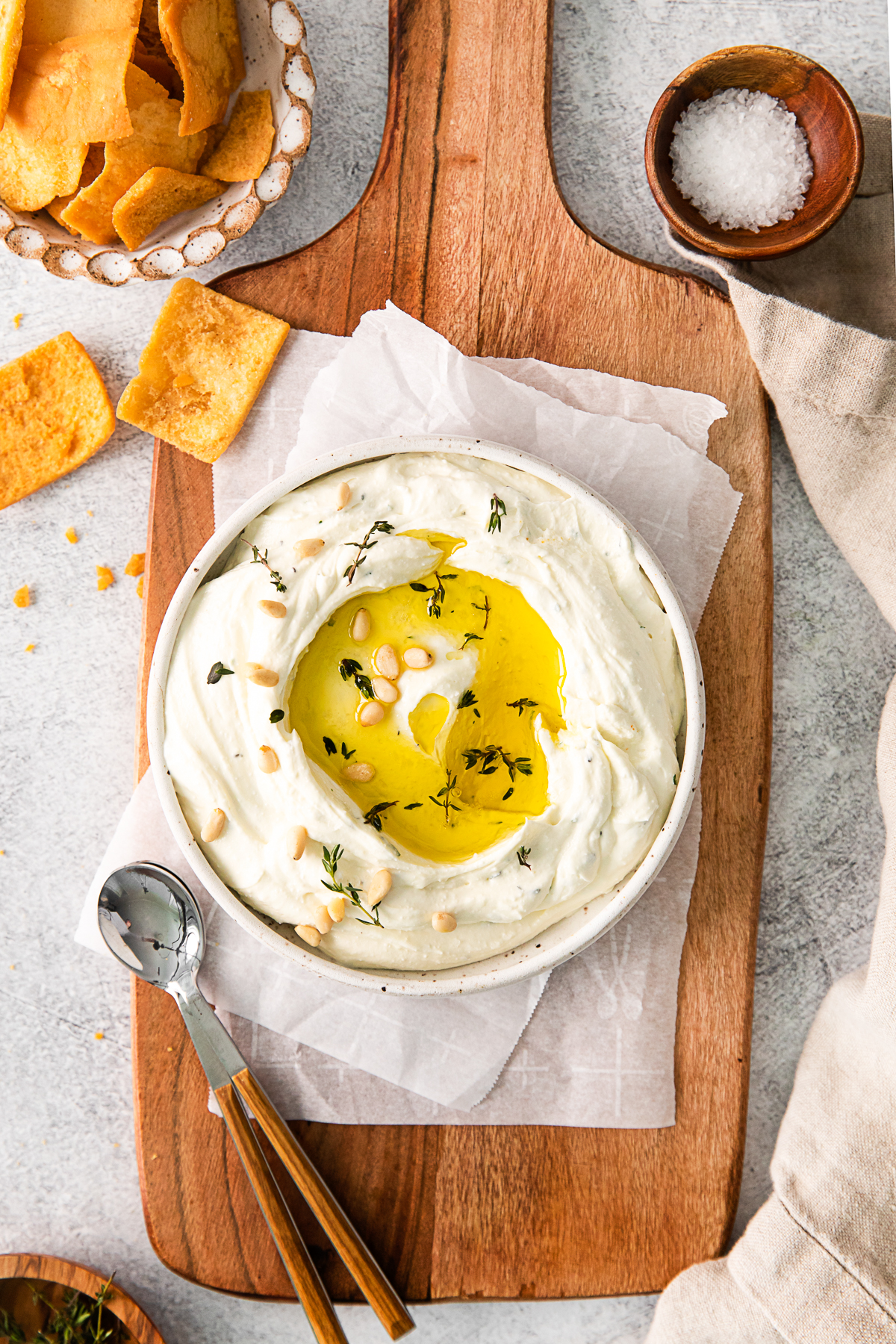 Roasted Garlic Whipped Feta garnished with pine nuts. 