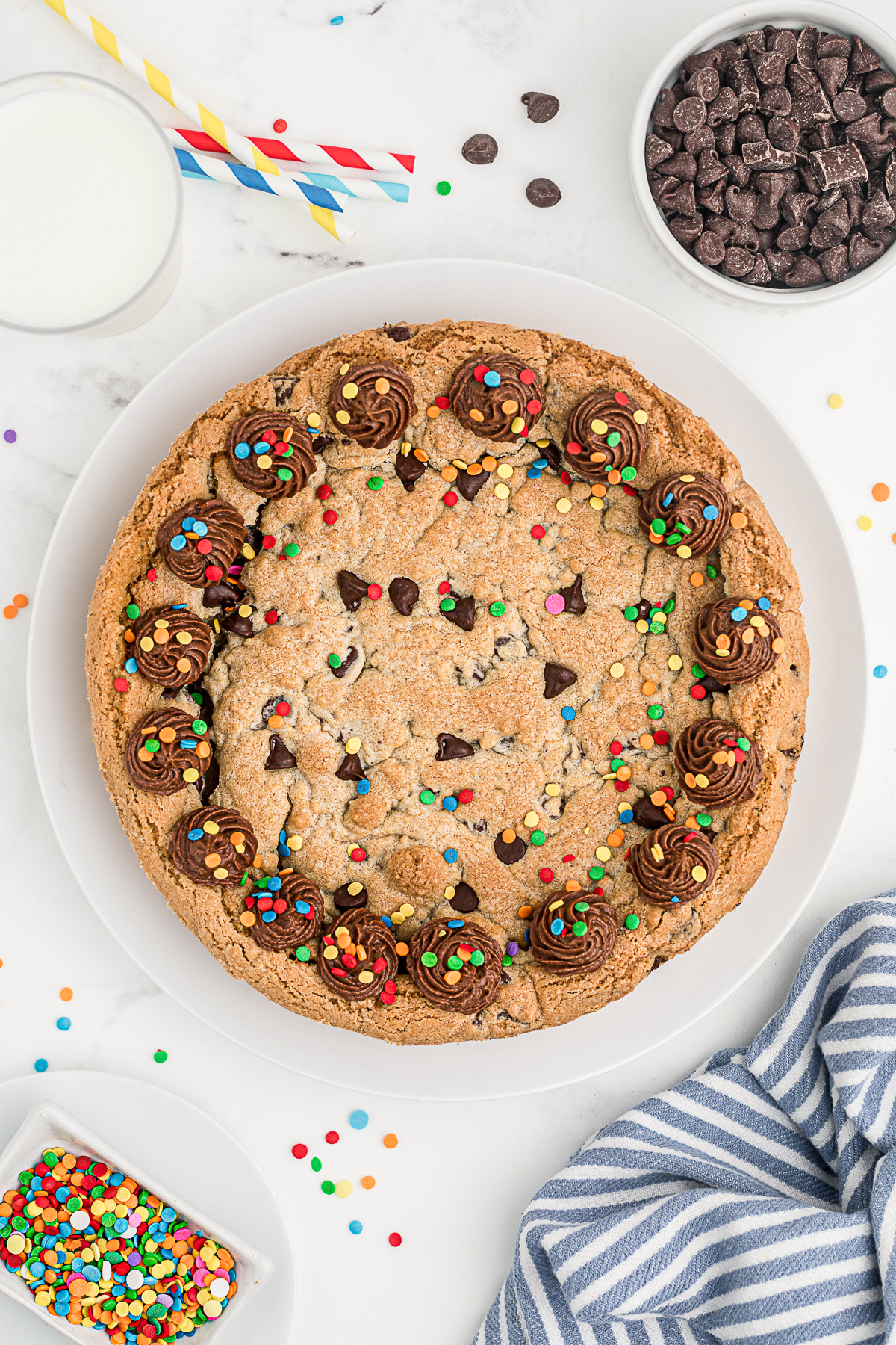 Chocolate Chip Cookie Cake covered in sprinkles. 