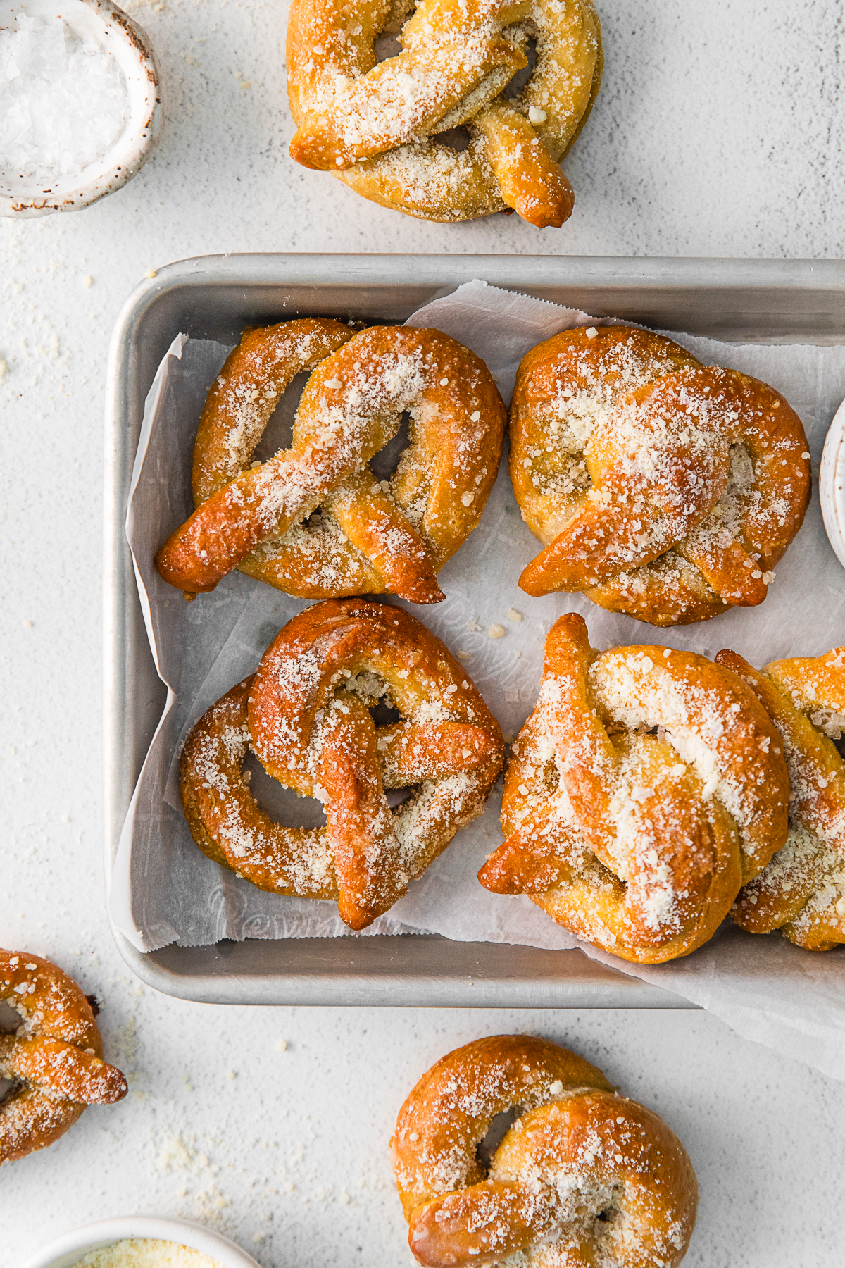 Garlic Parmesan Soft Pretzels topped with extra topping. 