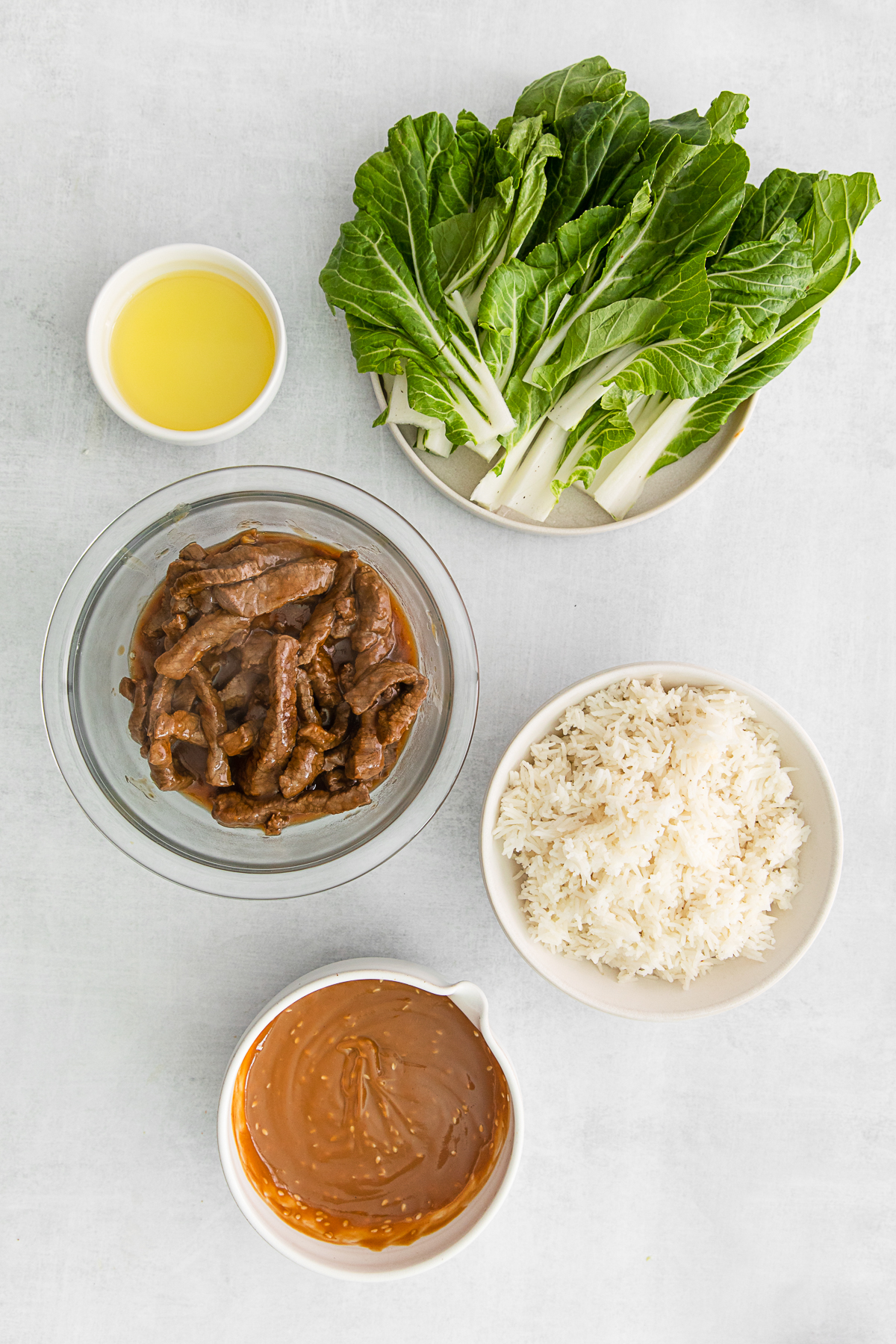 Ingredients for Beef Bulgogi Rice Bowls on a table. 