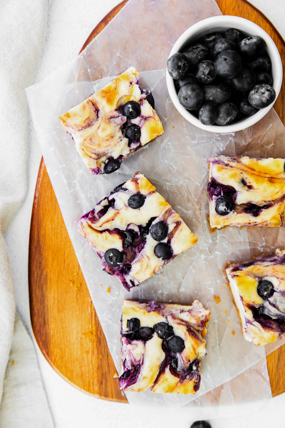 Blueberry Cheesecake Bars on a serving tray. 