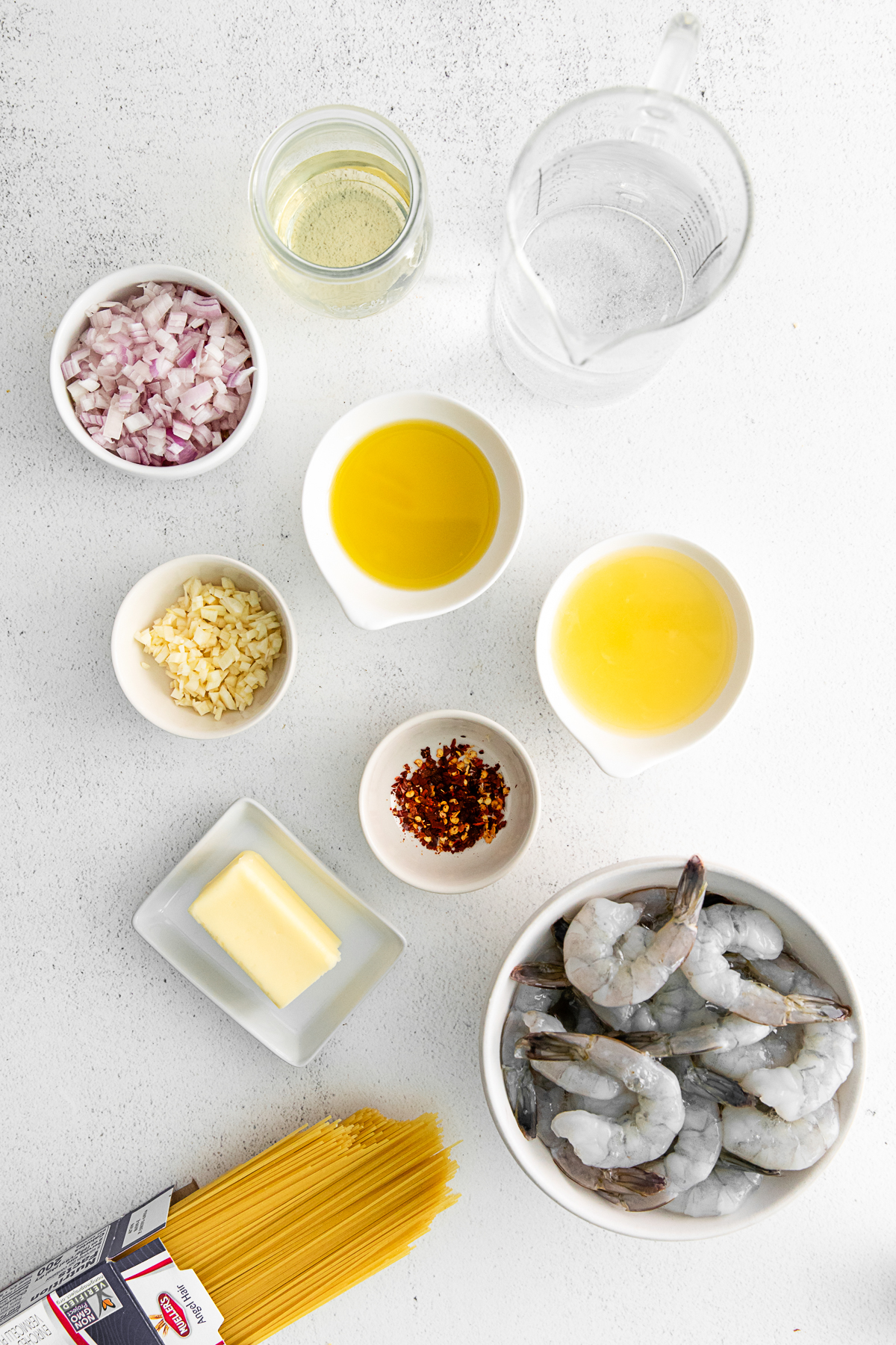 Ingredients for Instant Pot Shrimp Scampi on a table. 