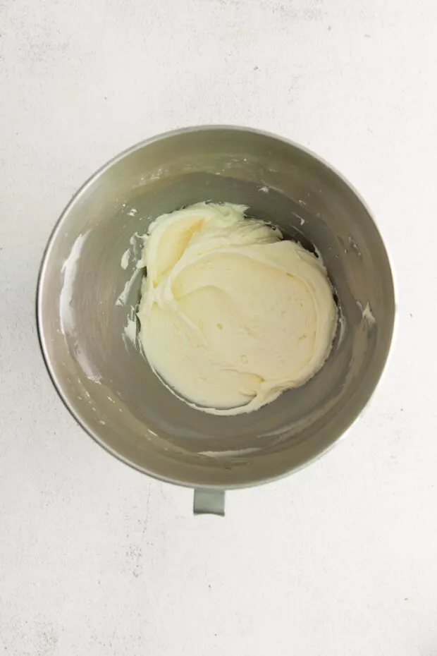 Vanilla mascarpone frosting in a mixing bowl. 